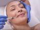 Beautiful young woman during skin treatment with hyaluronic acid in a beauty clinic