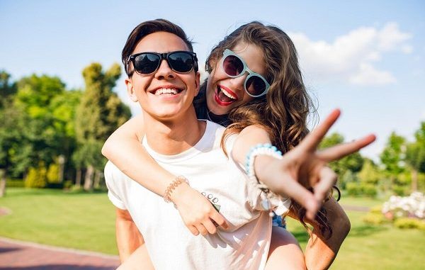 Portrait of cute couple having fun in the park