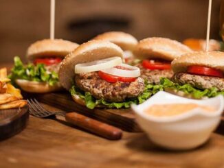 table-restaurant-wooden-full-delicious-burgres-fries-fries-hamburgers-classic-sauce