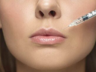 portrait-close-up-young-woman-white-wall-study-procedure-surgery-filling-lip augmentation Top 10 Lip Augmentation Clinics in Mexico