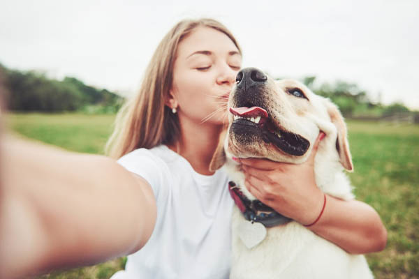 young-woman-labrador-outdoor-woman-on-green-grass-dog-labrador-retriever