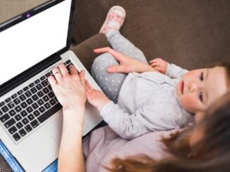 Top 10 best online baby stores in Mexico elevated-view-woman-her-daughter-using-laptop-white-screen-white