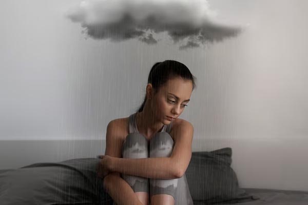 sad-woman-full-shot-sitting-bed